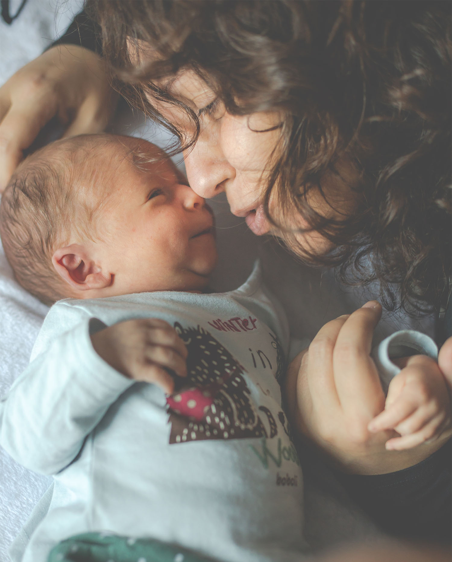 Mother holding newborn during in-home postpartum care visit by Welcome Home Baby in Austin, TX